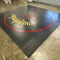 AK Athletic Equipment CLEARANCE 14' X 14' X 1 3/8" Roll Up Wrestling Mat - Black With Red Circles And Logo Wrestling Mats